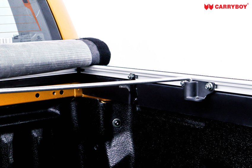 Support bow fixed to a bracket on the aluminium side rail inside the tray