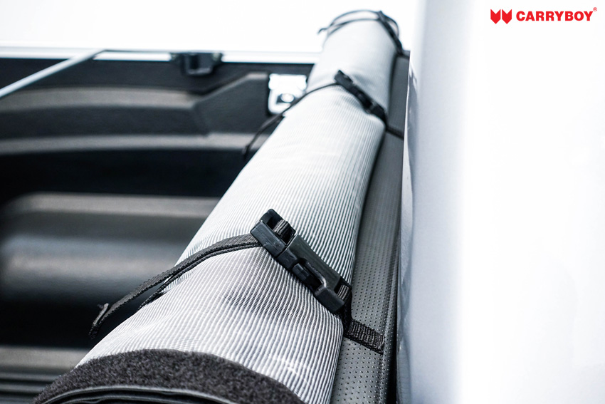 Rolled-up Softlid held behind the cab with straps and quick-release buckles