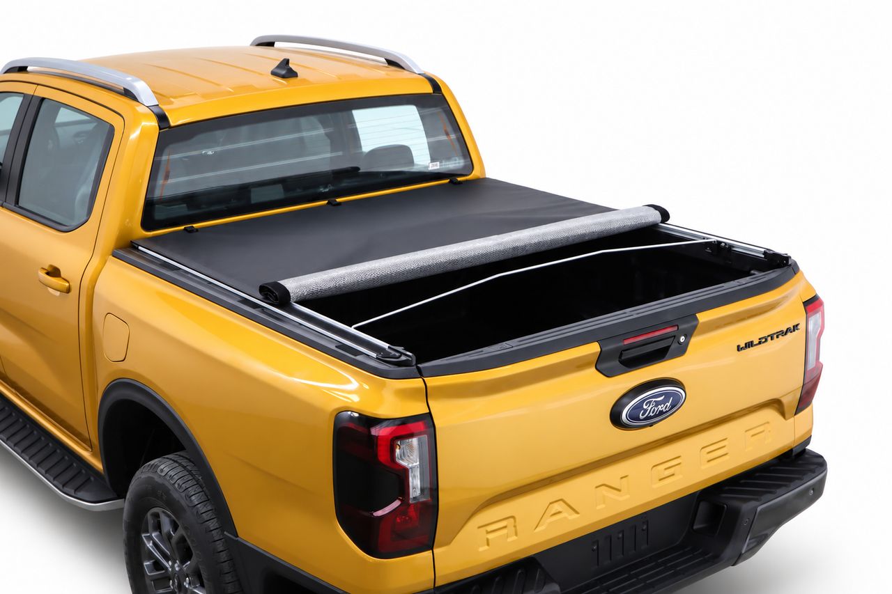 Softlid rolled halfway along the tray of a Ford Ranger