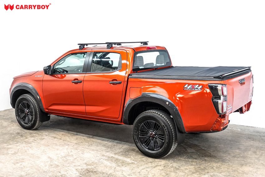 Orange Isuzu D-Max double cab with the Softlid closed, side view