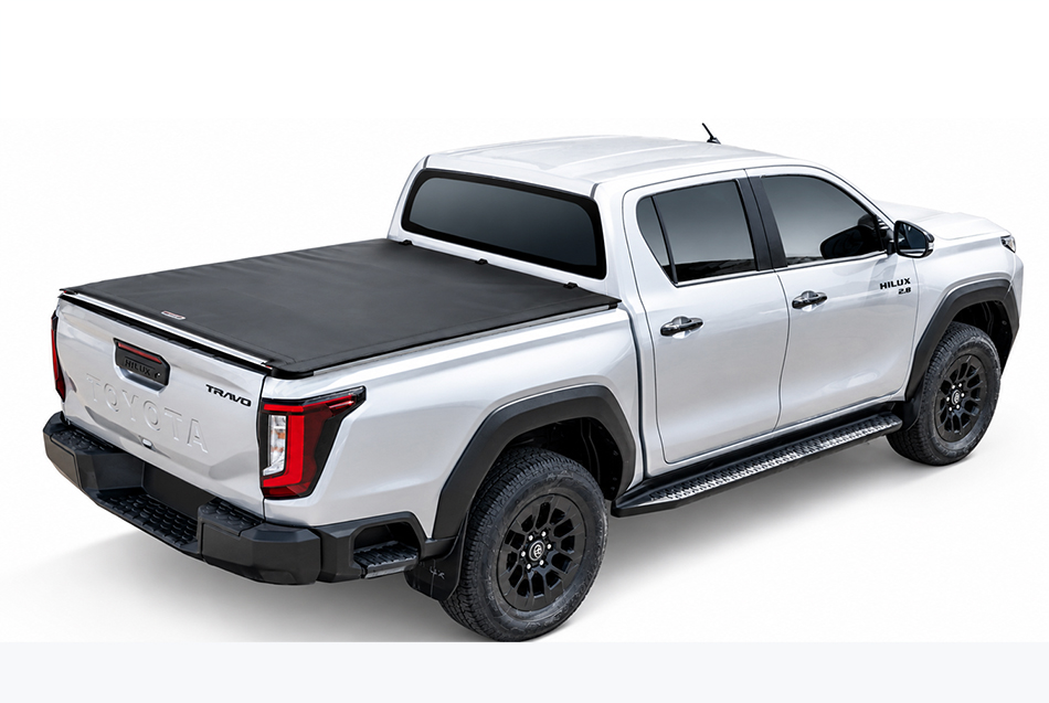Silver Toyota Hilux Travo double cab with the Softlid closed, high rear view