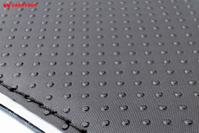 Close-up of the premium fabric with a raised dot texture