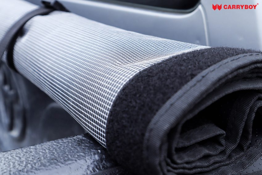 Rolled cover showing the mesh-reinforced laminate underside