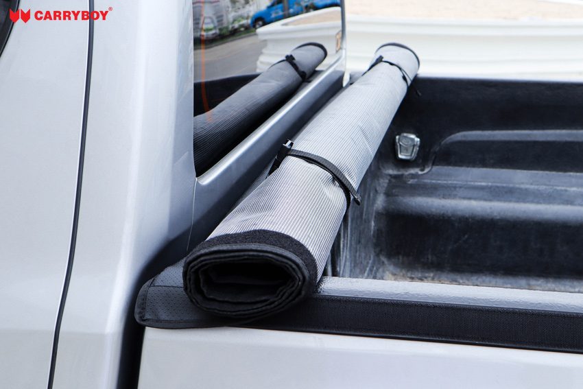 Softlid Lite rolled up and strapped at the front of the tray