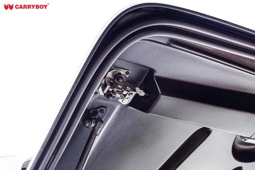 Edge of the Full Box lid with rubber seal, latch and gas strut mount