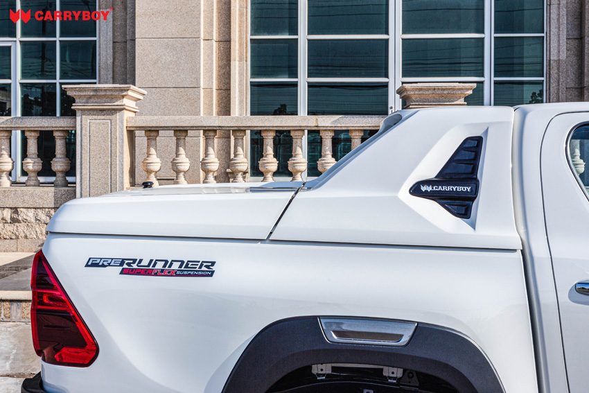 Sail panel of the Full Box on a white Toyota Hilux with vent and CARRYBOY badge